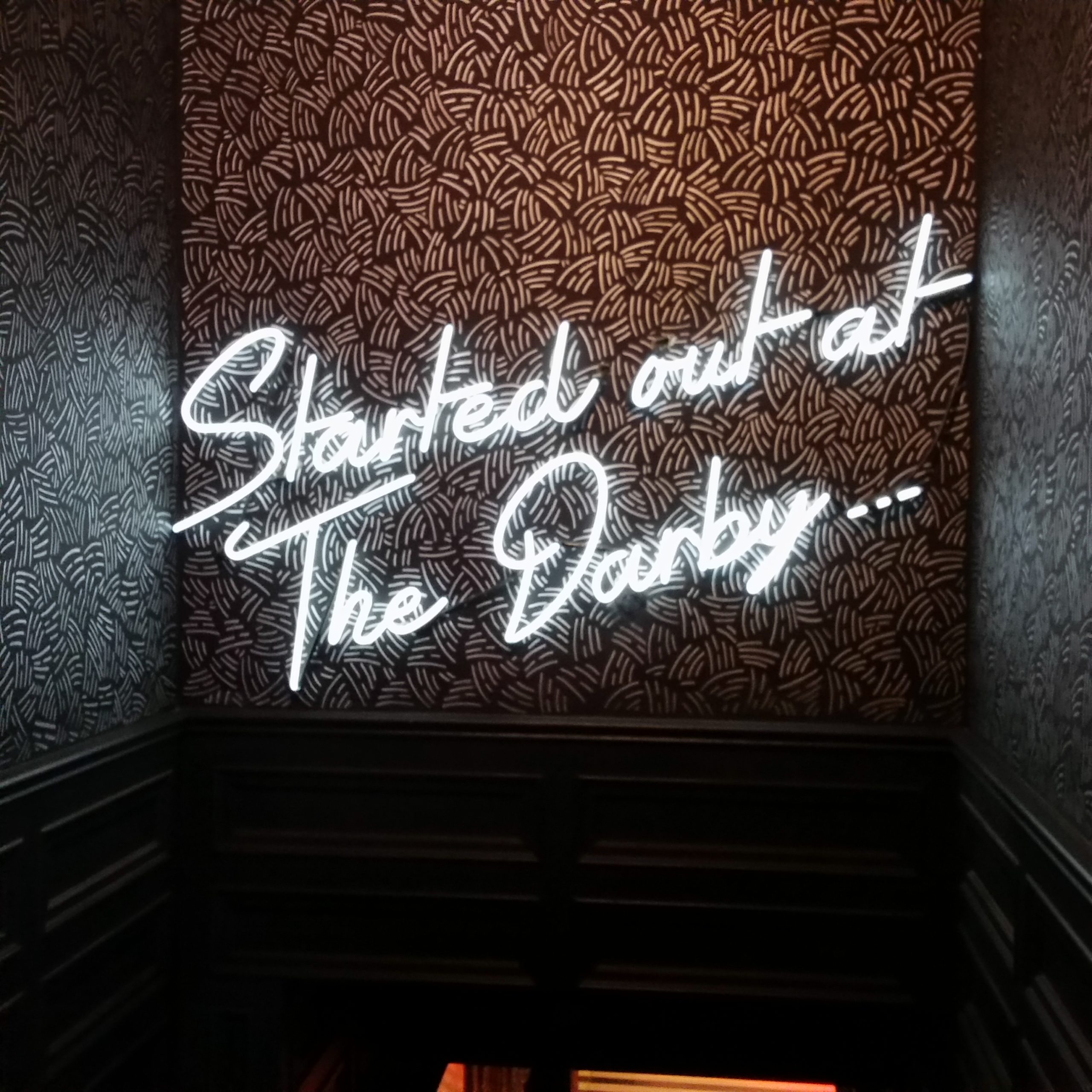 Custom script neon lettering at The Darby